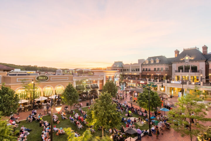 Outdoor concert hosted at Legacy Village outdoor mall in the summer