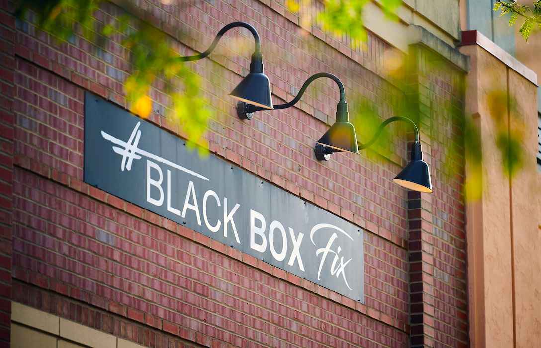 Black Box Fix sign on a brick building at the outdoor shopping mall Legacy Village